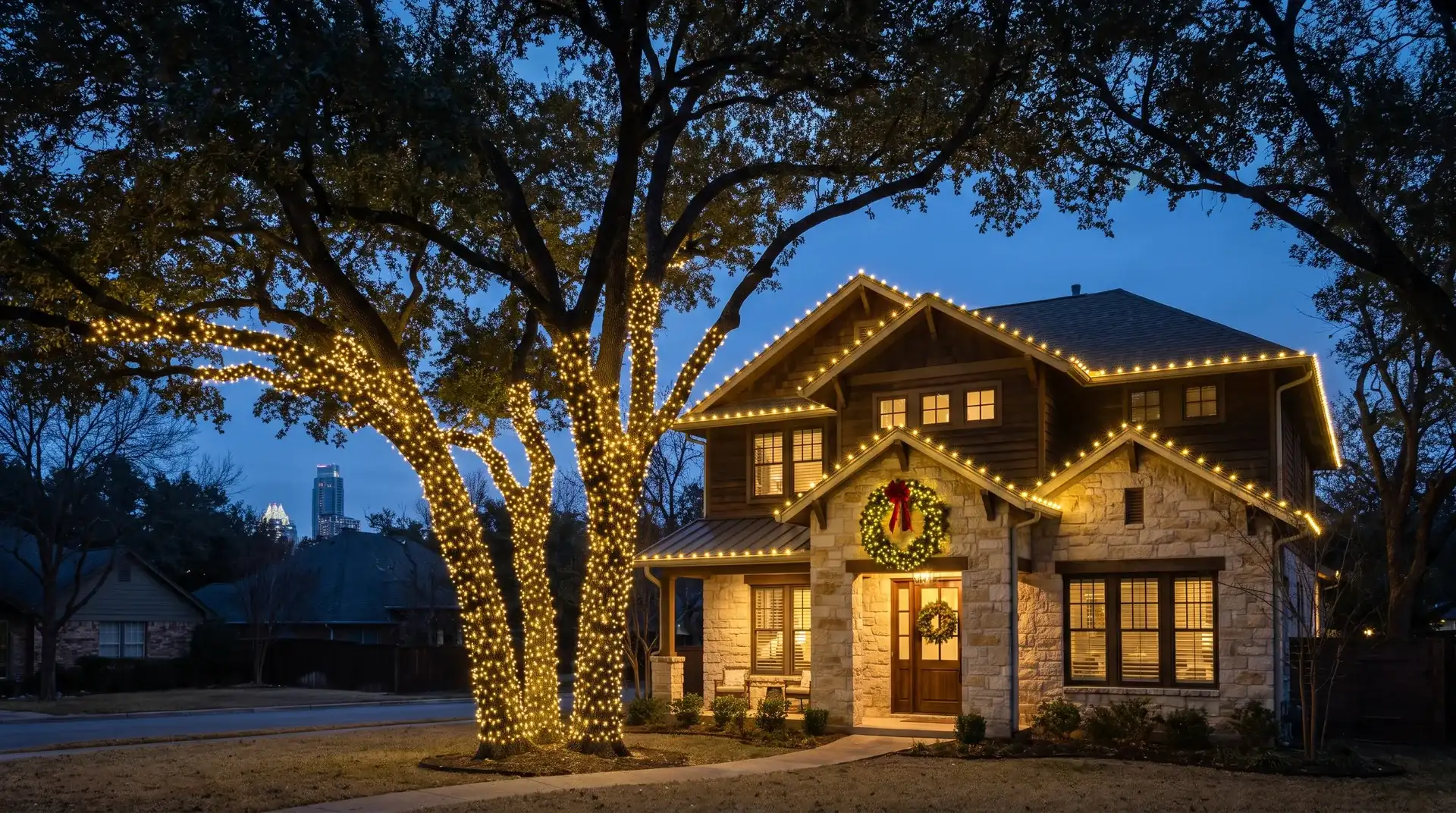 Professional Christmas light installation on a craftsman home under live oaks in Austin, TX