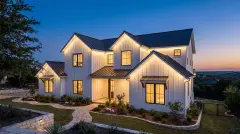 Permanent LED Christmas lights hidden under the eaves of a modern farmhouse home in Leander, TX