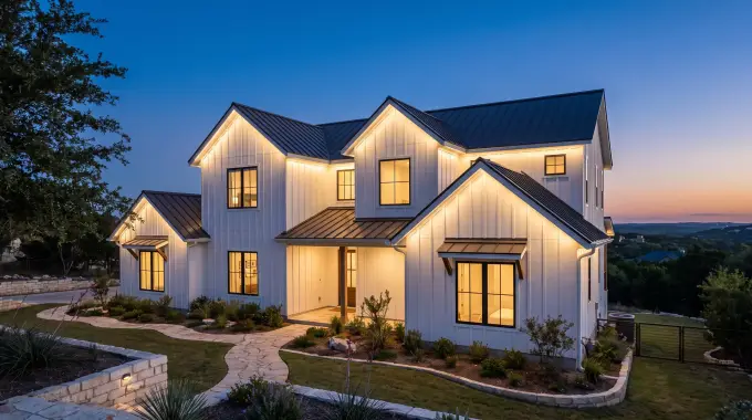 Permanent LED Christmas lights hidden under the eaves of a modern farmhouse home in Leander, TX